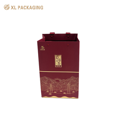 Sacs cadeaux en papier rouge écologiques Un sac d'emballage de vin avec poignée de ruban