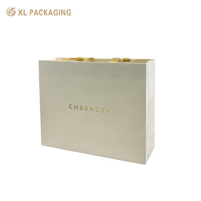 acheter Sac cadeau en papier imprimé en feuille d'or personnalisé haut de gamme avec poignées en ruban de satin et haut plié renforcé fabrication en ligne