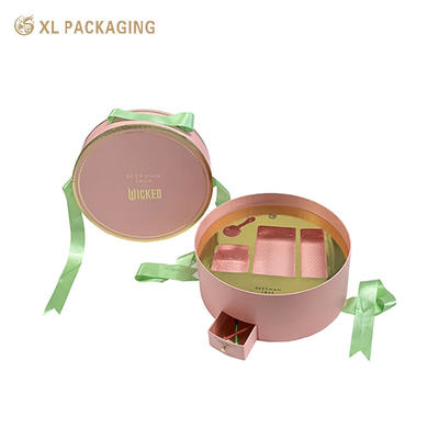 acheter Boîtes personnalisées de luxe en gros Boîte de papier cosmétique ronde avec un design unique Boîte de tiroir mini Boîte à ruban vert Poignée et plateau en or Pour les produits de beauté essentiels online manufacture