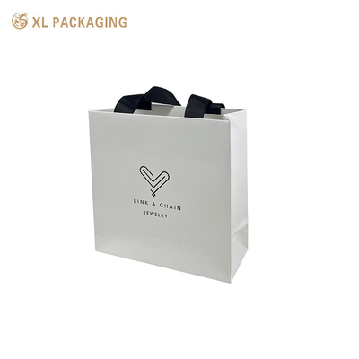 acheter Hôtel jetable en gros de couleur Pantone personnalisé en utilisant un sac en papier avec poignée de cordes dorées online manufacture