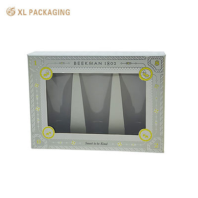 Boîte cadeau imprimée sur mesure avec du carton rigide transparent pour fenêtre en PET et un timbre en papier d'argent pour les cosmétiques